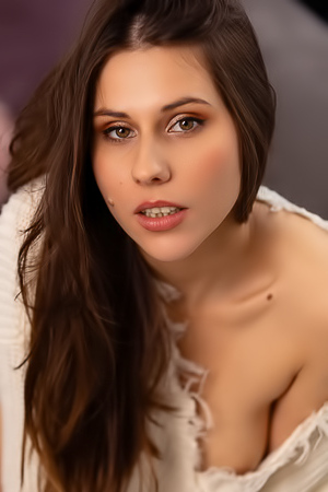 Amber Slassh Teases With Perky Nipples And Spread Legs On The Couch